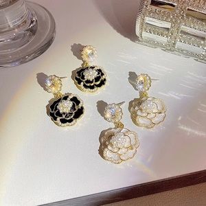 Withe and black camellia earrings